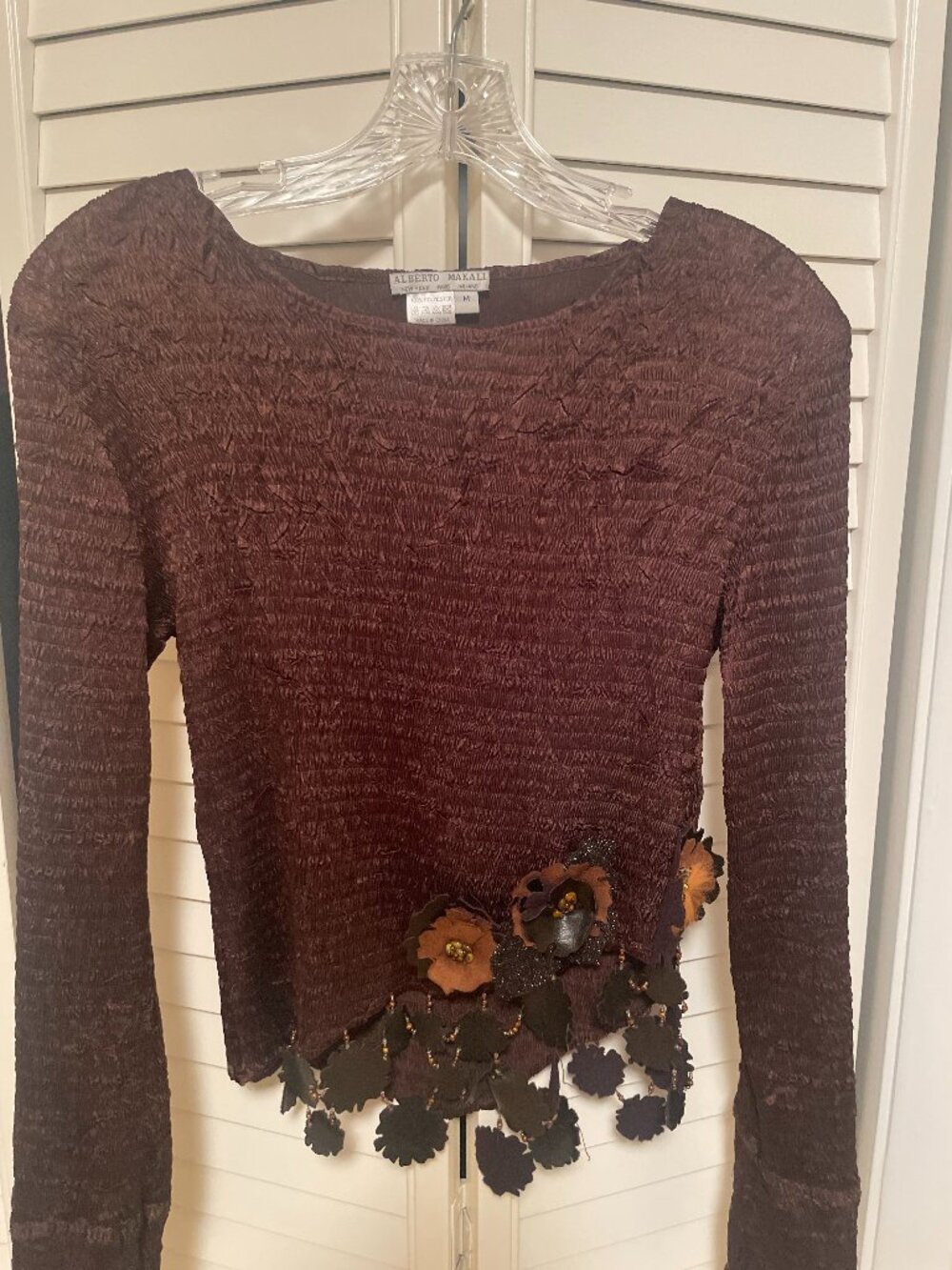 Alberto Makali arty blouse with leather flowers in cascade.